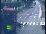 CCTV: Narrow escape for driver as truck smashes scooter in China